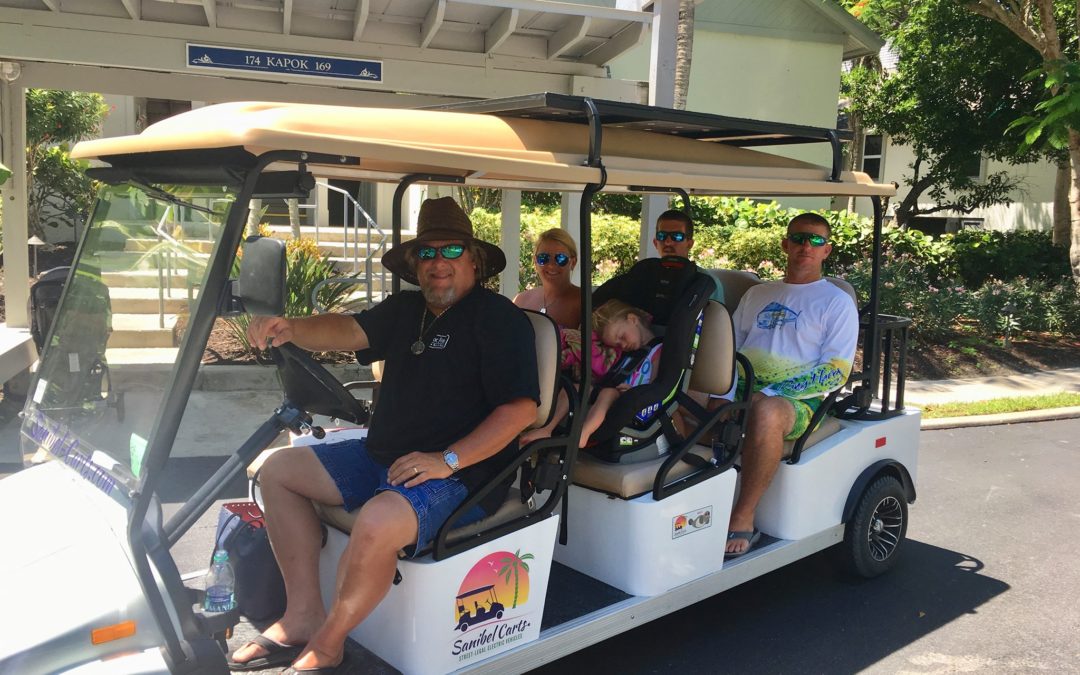 Photo of members on golf cart